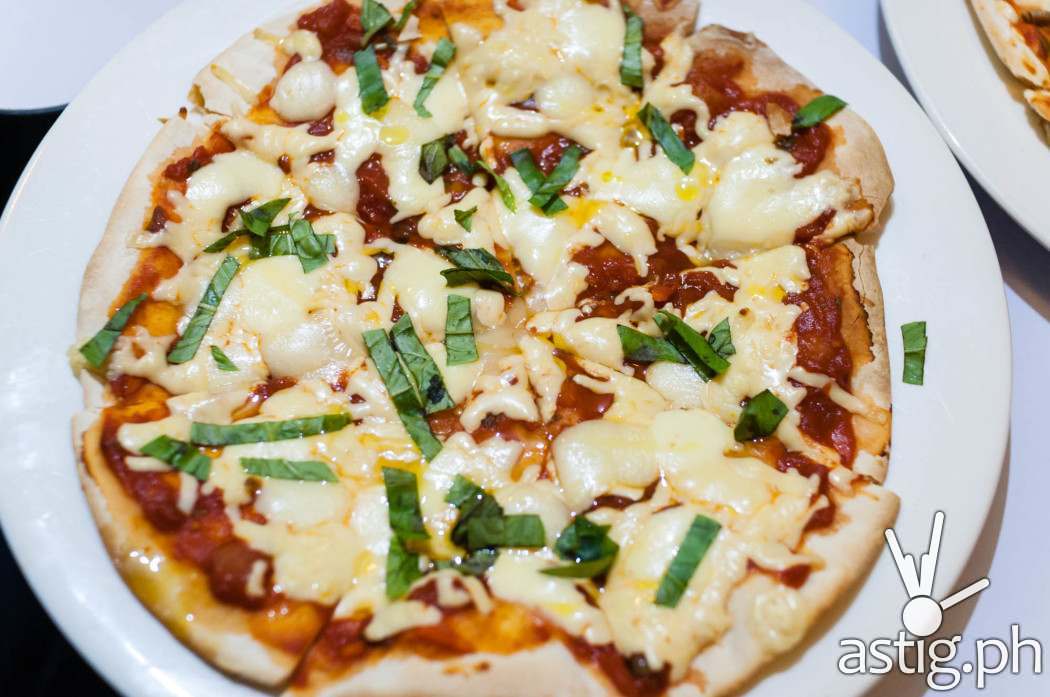 Four cheese pizza with truffle oil (210 PHP)