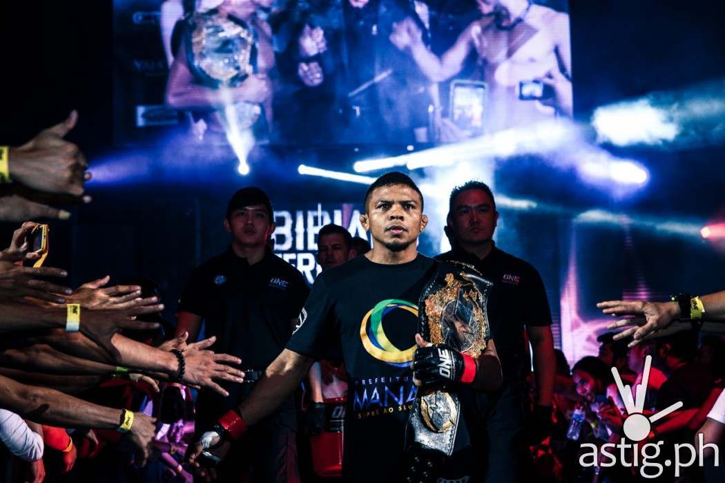 Bibiano Fernandes from Brazil enters the ring carrying the ONE FC Bantamweight World Championship belt