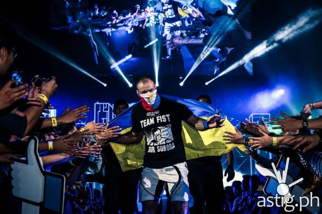 Igor Subora from Ukraine enters the ring wearing a mask showing the Philippine flag