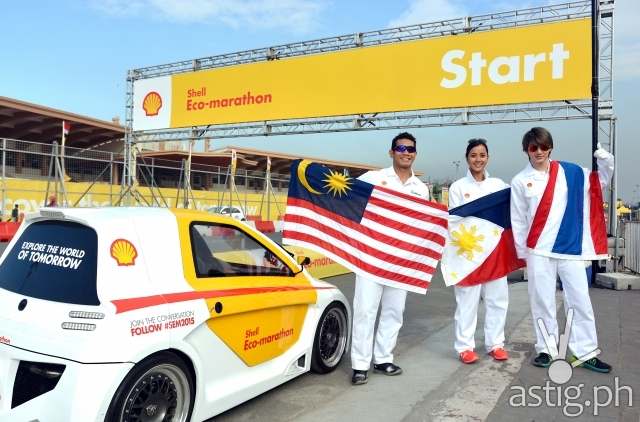 Celebrities fly their flags at Shell FuelSave Fact or Fiction Celebrity Driving Challenge Fahrin Ahmad, Bianca Gonzlez and Pichaya “Golf” Nitipaisalkul fly their flags track side at Shell FuelSave Fact or Fiction Celebrity Driving Challenge Shell Eco-marathon in Manila, Philippines, Friday, Feb. 27, 2015. (Jinggo Montenejo/AP Images for Shell)