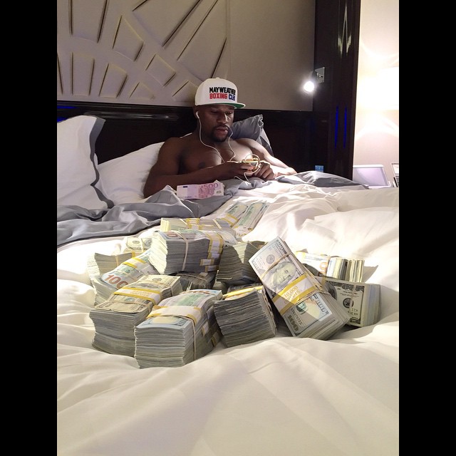 Floyd Mayweather in bed with money