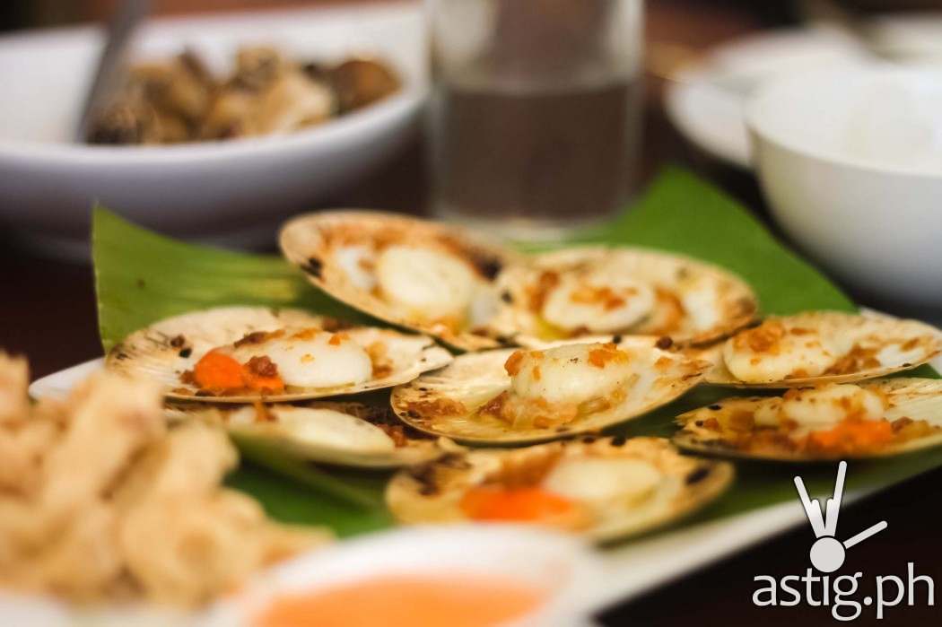 Ocho Seafood and Grill's Baked Scallops, a butter rich entree smothered in spices, is a definite must-try in Tacloban City