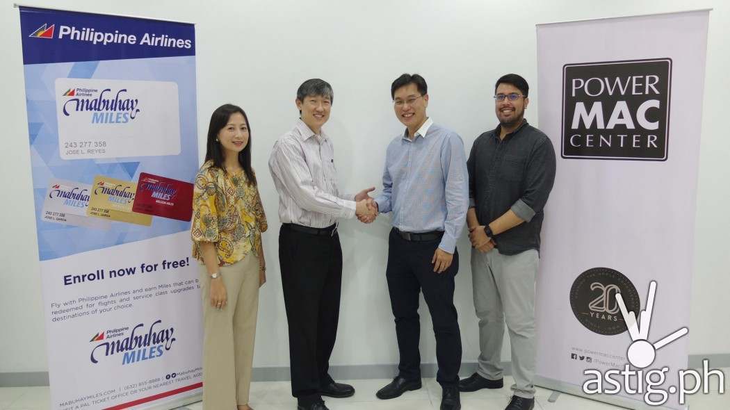 ​Chief Executive Officer Lawrence Sison (2nd from right) of Power Mac Center and Vice President-Ancillary Business Kevin Hartigan-Go (2nd from left) of Philippine Airlines (PAL) smile as they shake hands following the signing of a partnership agreement that allows the most reliable Apple partner in the country to ​​reward its customers with PAL Mabuhay Miles. They are joined by Power Mac Center Marketing Director, Joey Alvarez (far right) and PAL Asst. Vice President - Loyalty Program, Marietta Casanova.
