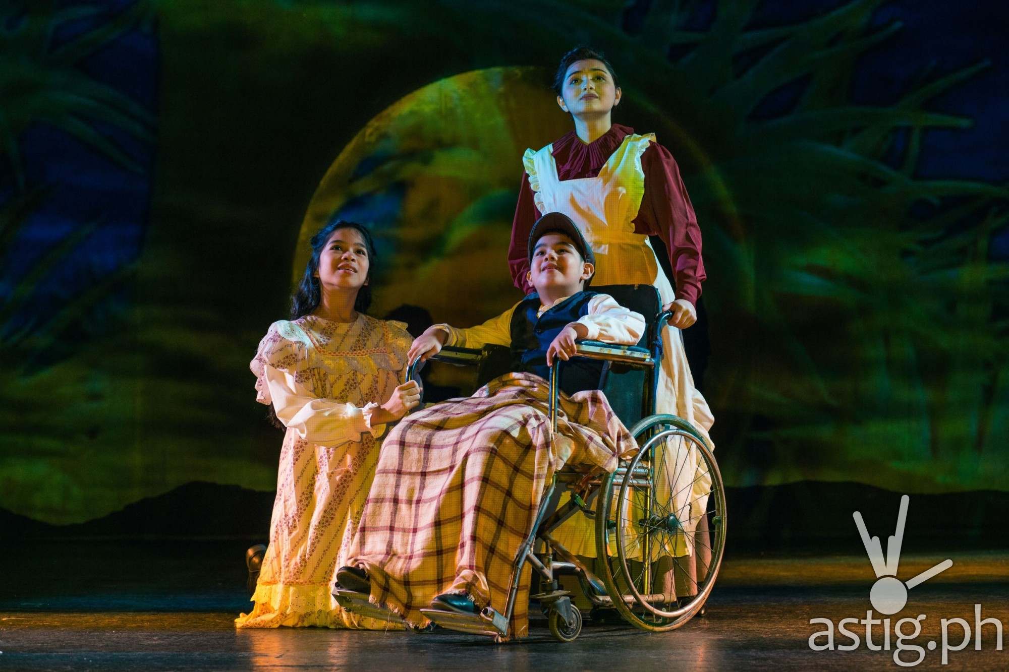 Becca Coates playing the role of Martha, the housekeeper_ and Ashlee Factor and Albert Silos portraying the young Mary Lennox and Colin Craven, respective