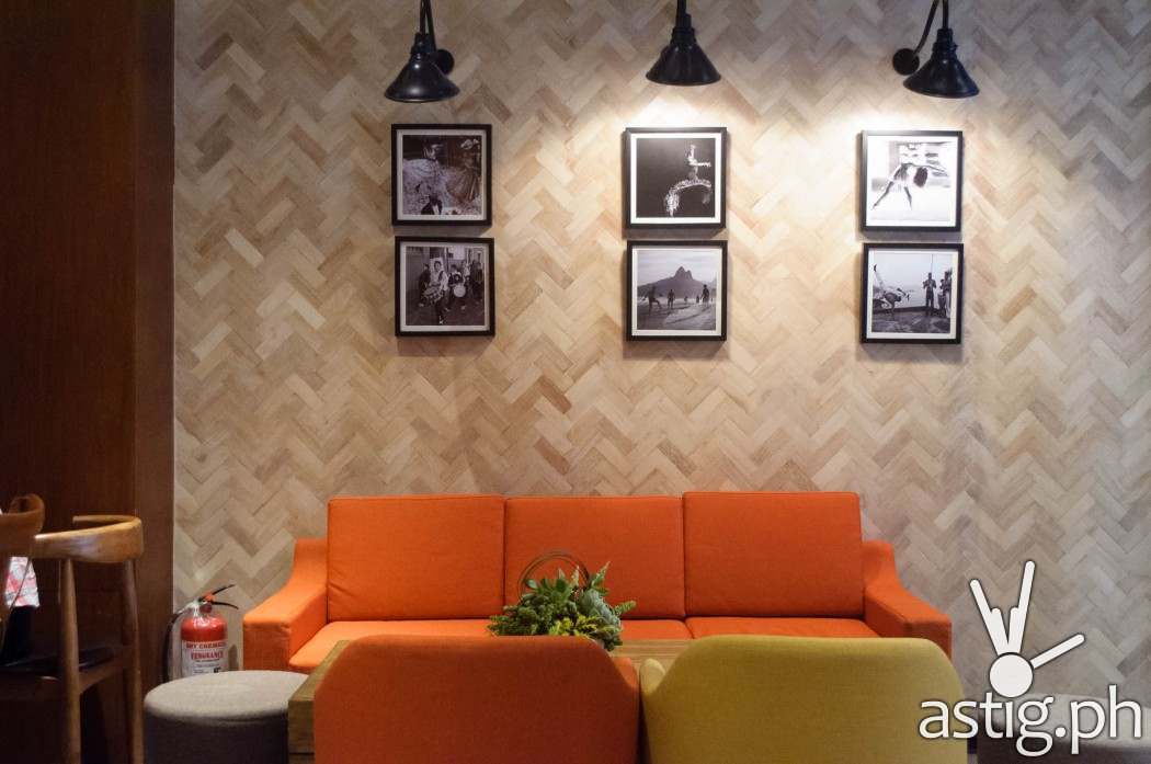 Art pieces accentuate the spacious, well-lit interiors of Café Enye