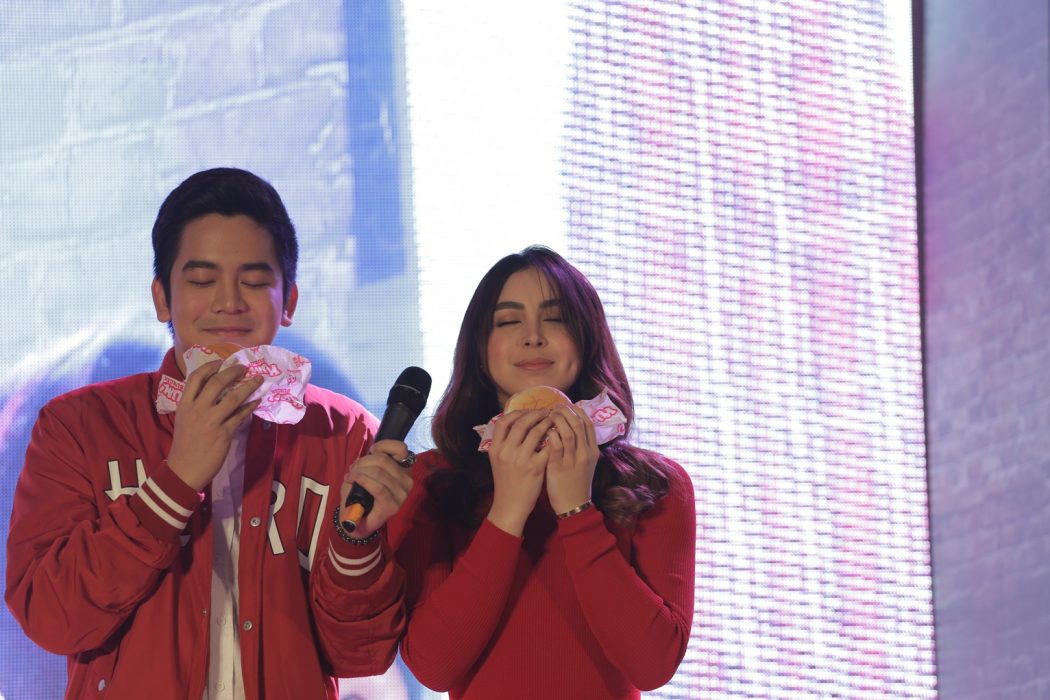 "Langhap" then "Sarap" Joshua Garcia and Julia Baretto demonstrate the two-step process of enjoying the Jollibee Yum Burger
