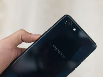 OPPO F7 Youth rear handheld showing camera