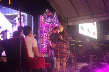 Moira serenading the newly engaged couple