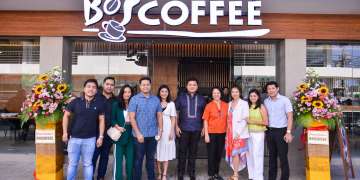 Bo's Coffee Surigao owners Darryl and Tracy Laurente (center) with the team