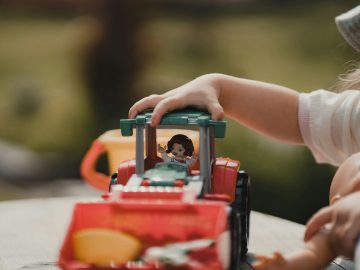 a small child playing with a toy truck