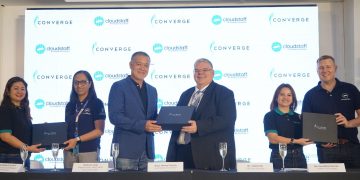 A group of people standing on a stage Description automatically generated